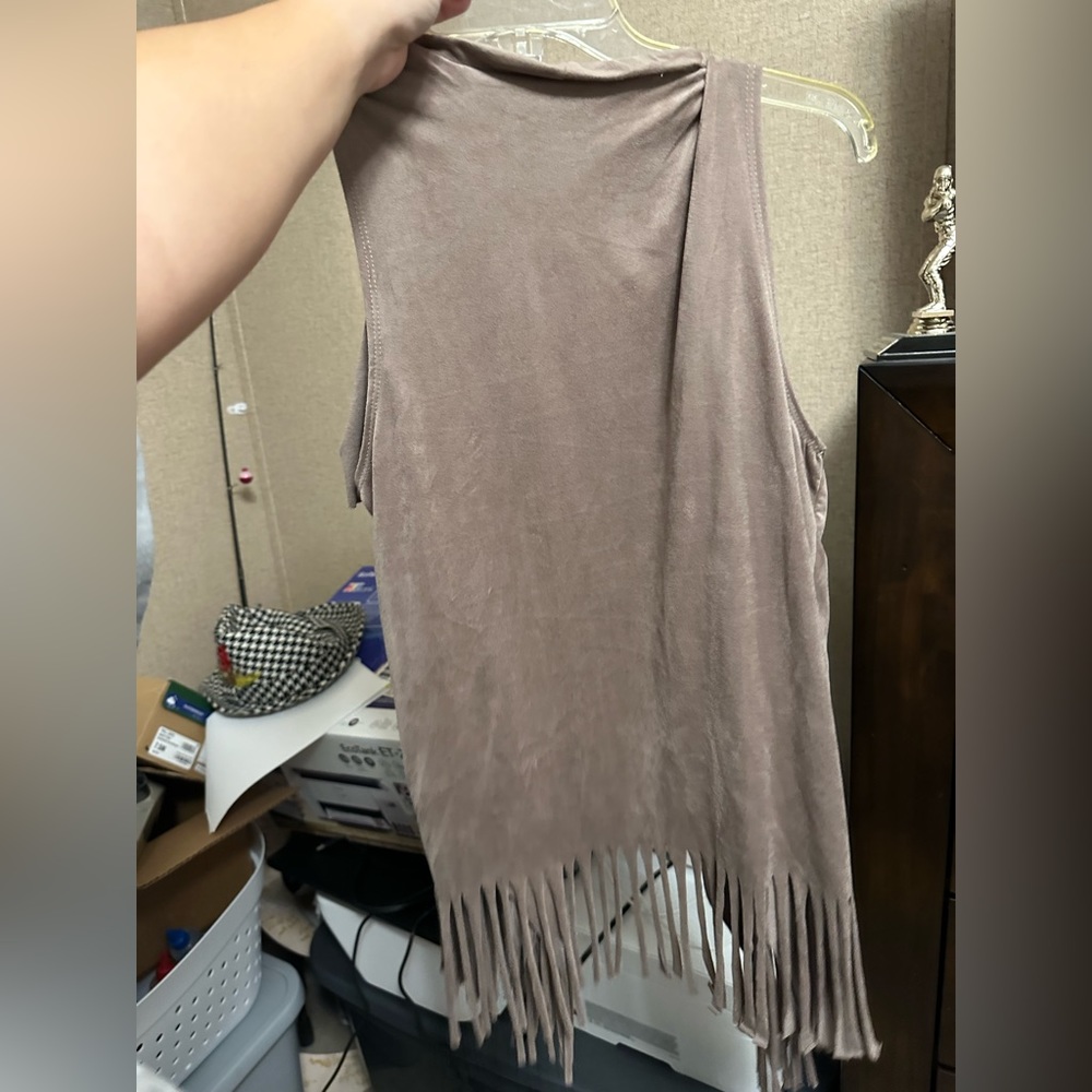 Suede like fringe vest. Barely worn, was used for a Halloween costume.
